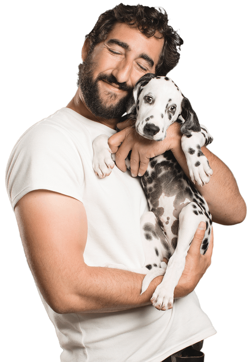 young happy man holding dalmatian puppy